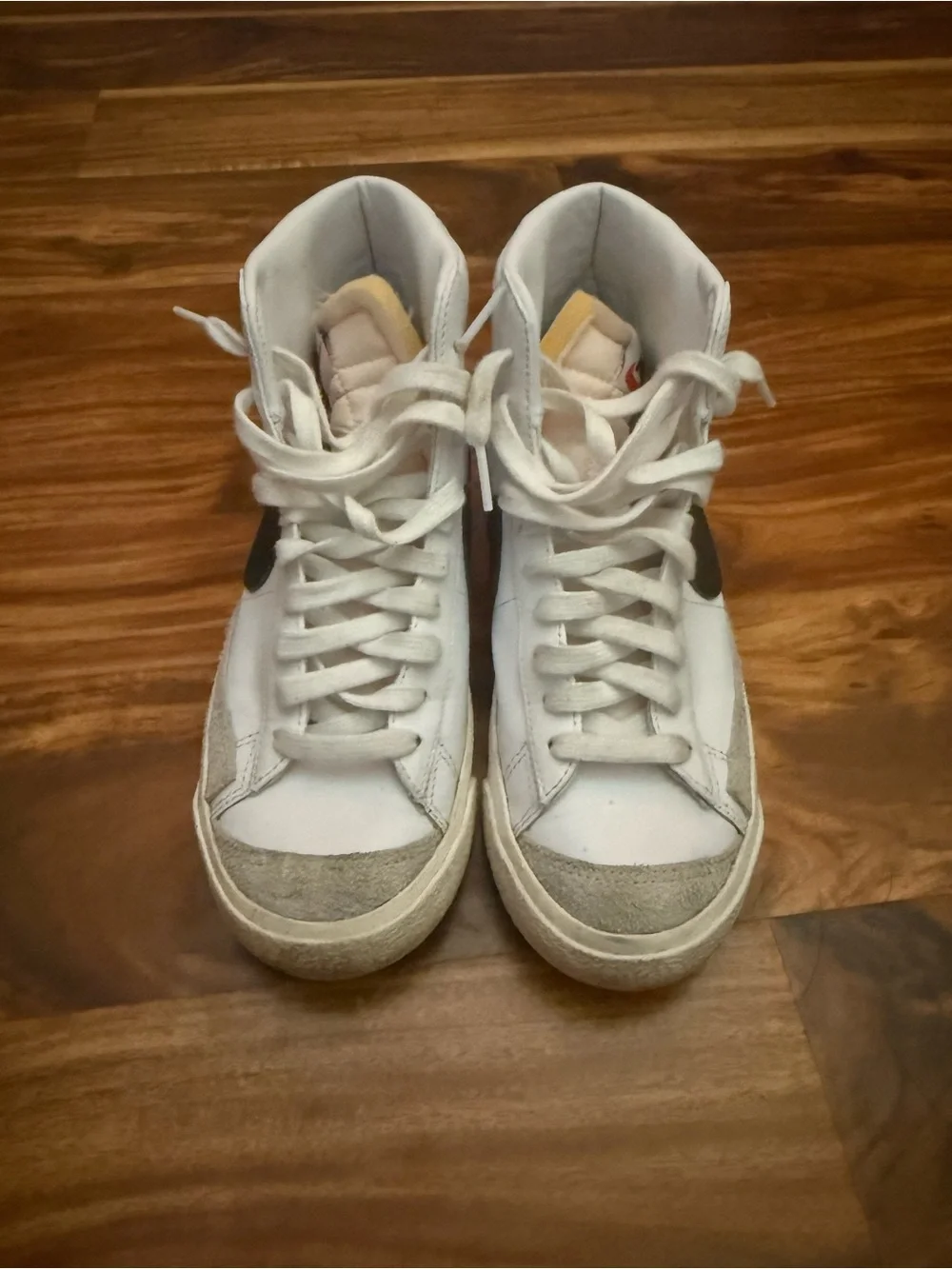 Nike White High-Top Sneakers with Black Swoosh
